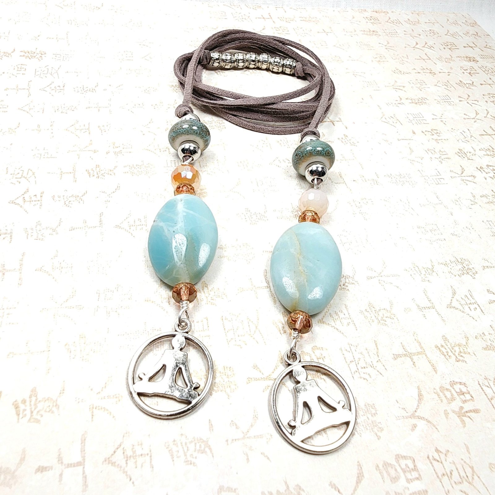 Boho Yoga Necklace โ Handmade Jewelry with Silver Yoga Pose Charm, Amazonite Stones, Porcelain & Faceted Beads on Grey Faux Suede Cord